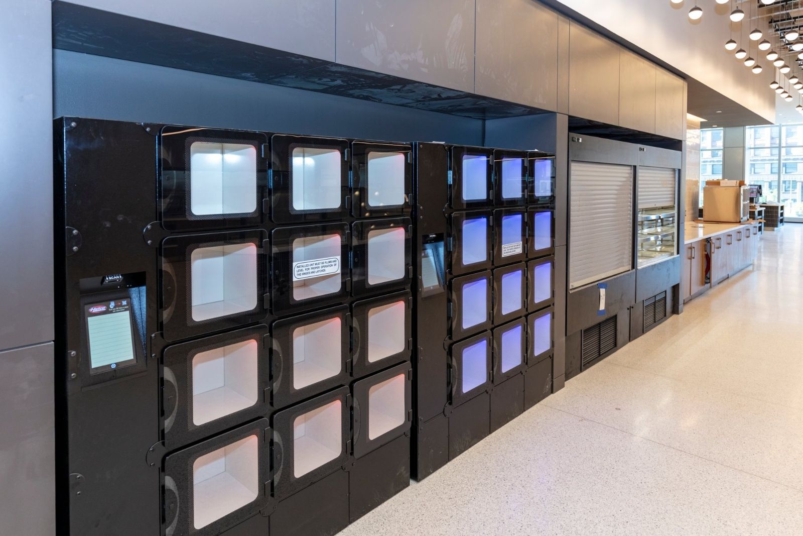 Sherwin-Williams: Wall of lit food pickup lockers