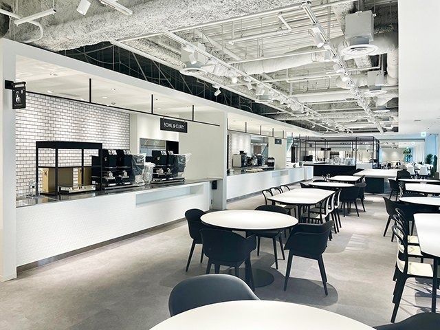 Shiseido: Counter and tables in a white café area