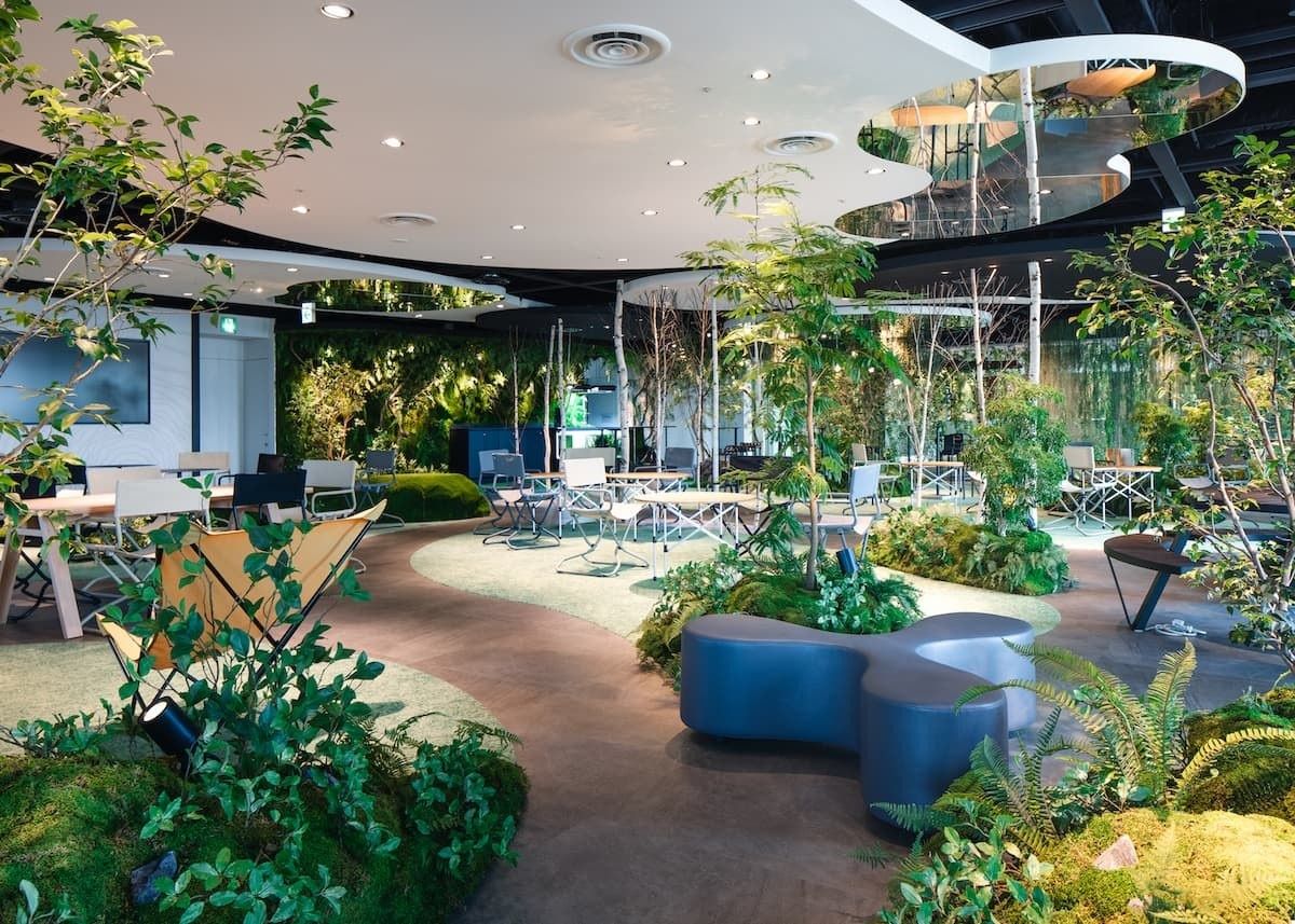 Shiseido: Seating among potted plants under a low ceiling