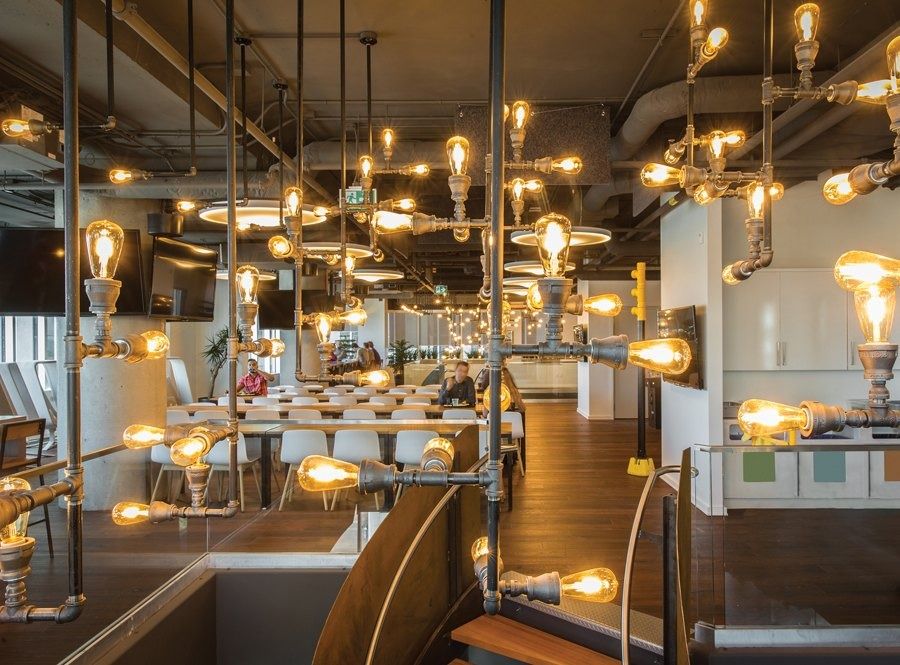 Shopify: Exposed bulbs and piping lamps over a cafeteria, Shopify Ottawa