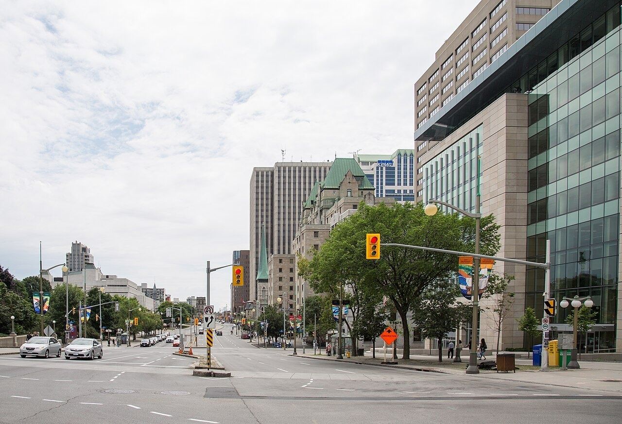 Wide Elgin Street in Ottawa with trees and buildings