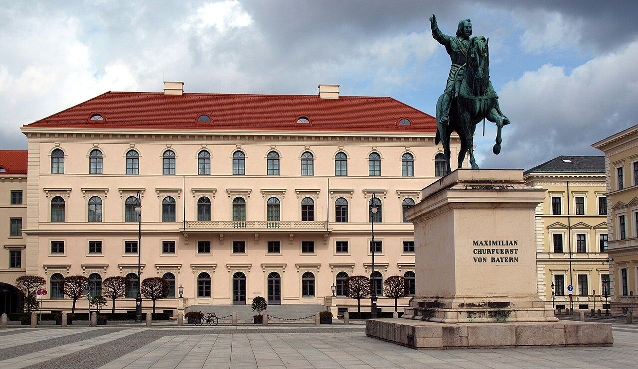 Palace on Wittelsbacherplatz with a statue in front