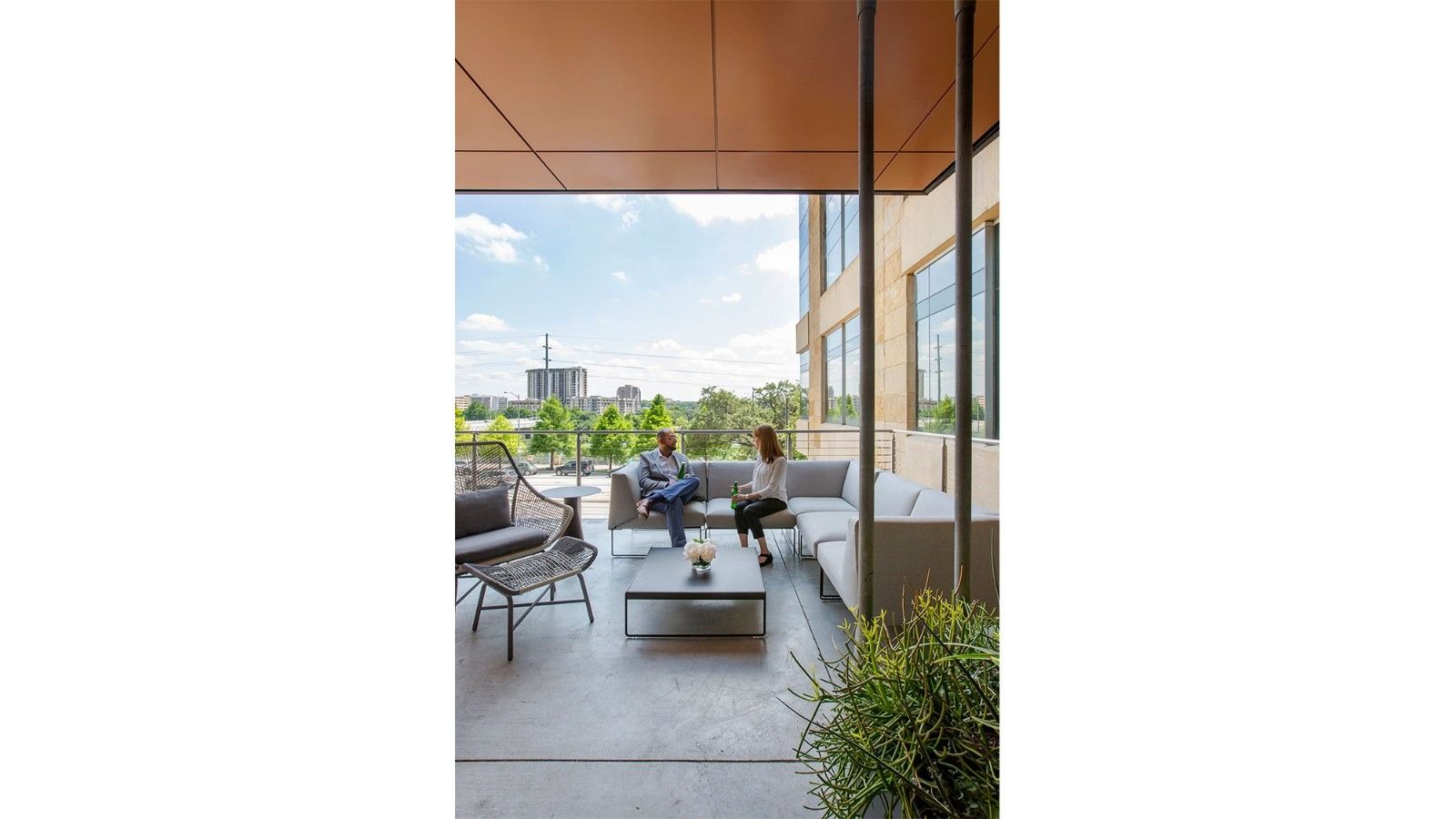 Silicon Labs: A balcony with chairs and city views