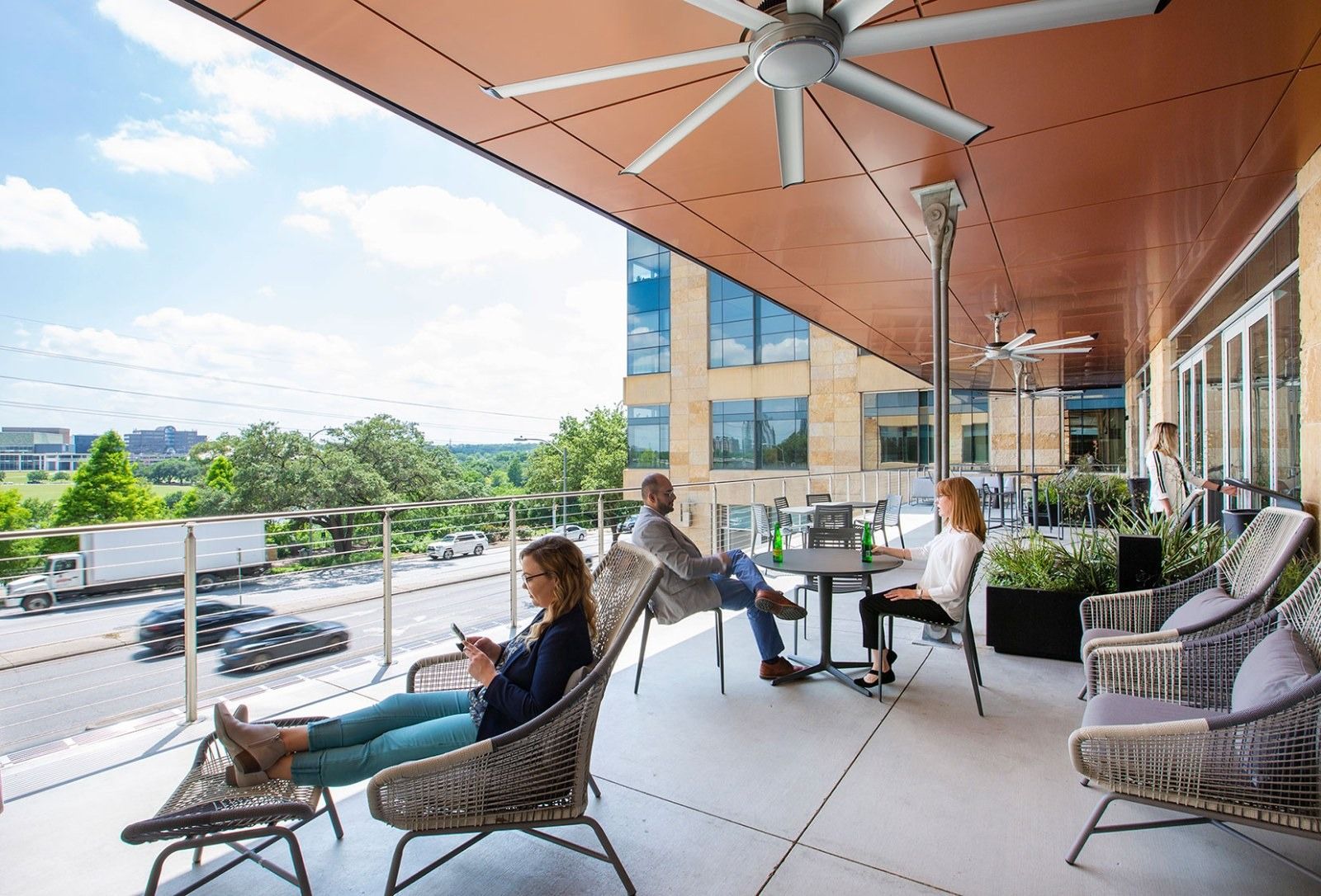 Silicon Labs: A covered balcony with lounge chairs and a fan