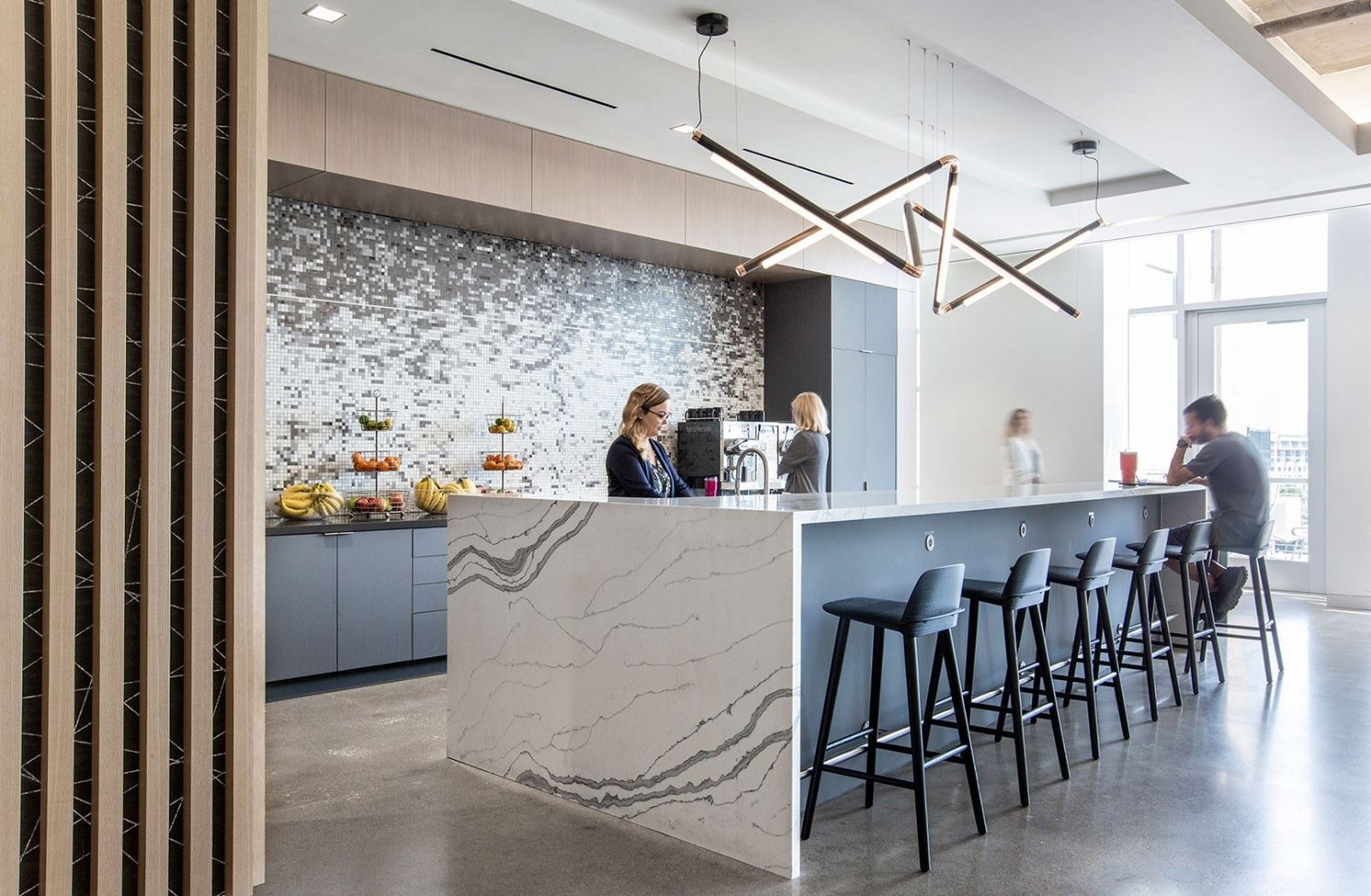Silicon Labs: A kitchen bar with a stone counter and stools