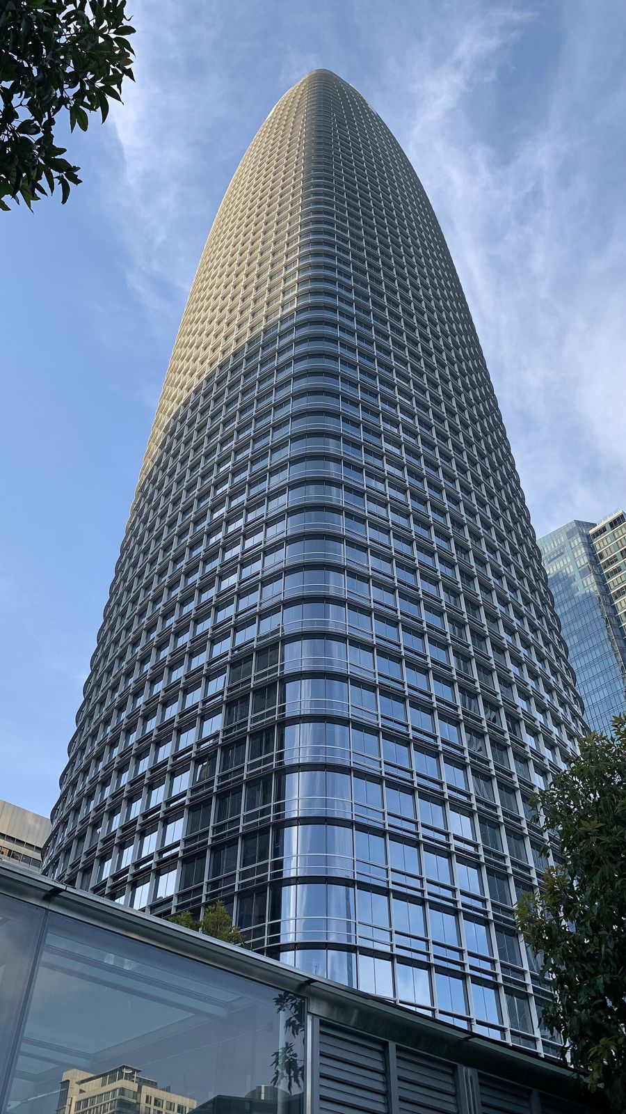 Slack: The tower rising behind trees