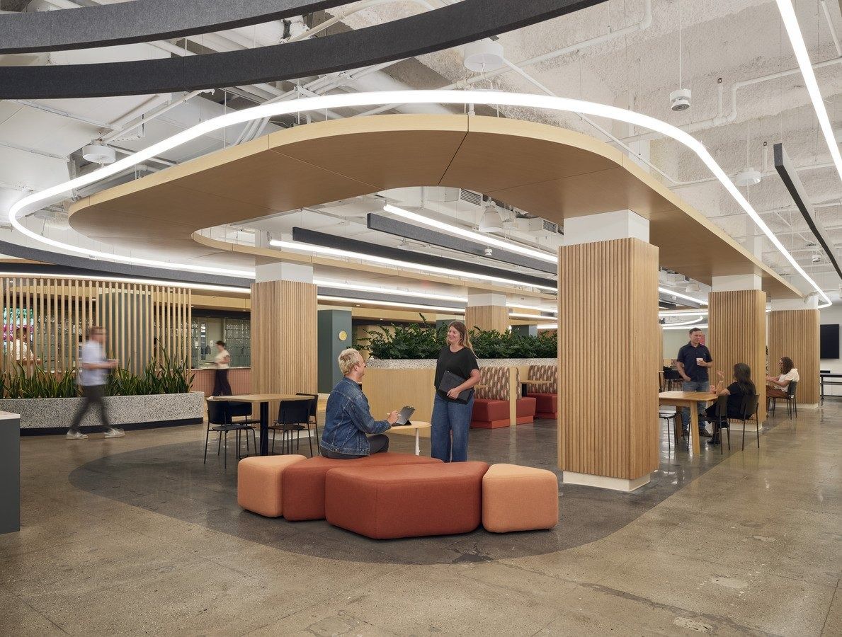 Snap: A lounge under a wooden canopy with orange seats