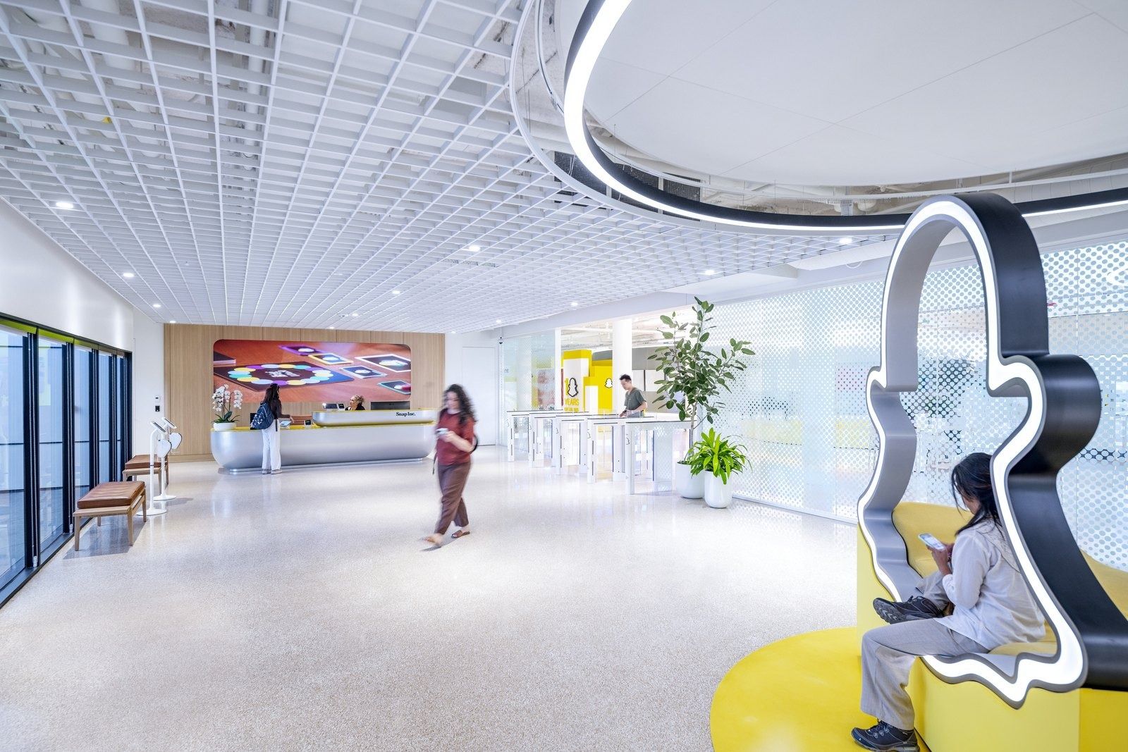 Snap: An open lobby with a ghost seat and a video wall