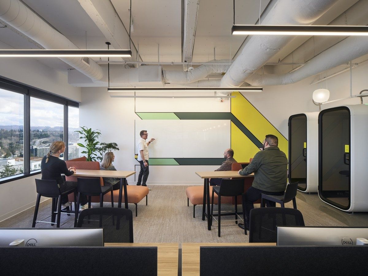 Snap: Work tables with yellow graphics and phone booths