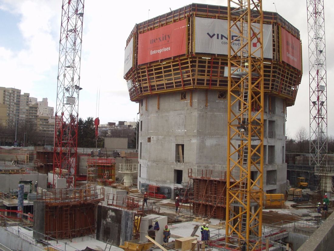 Concrete tower core with cranes and scaffolding on a building site