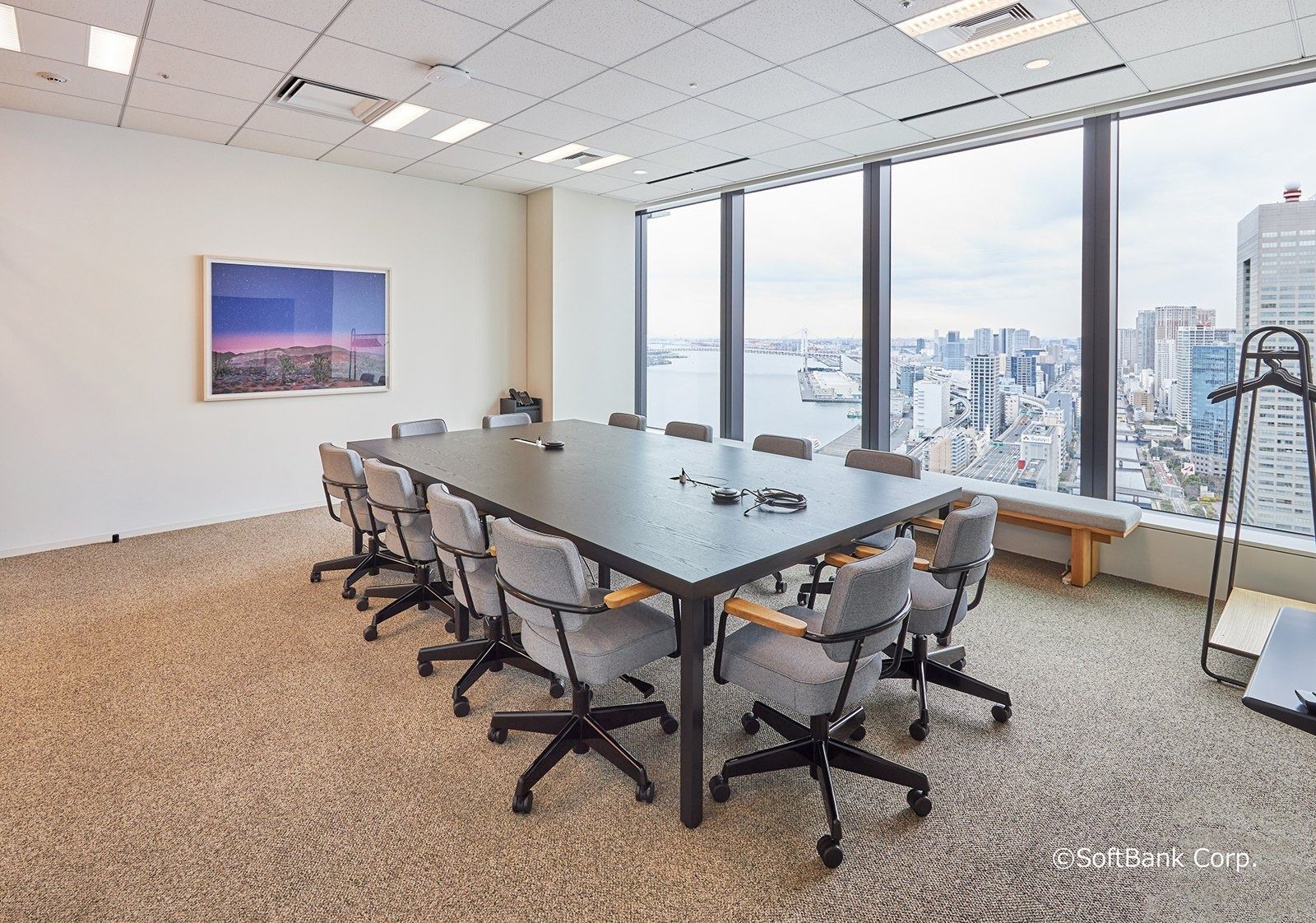 SoftBank Group: Long meeting table by a window over the bay