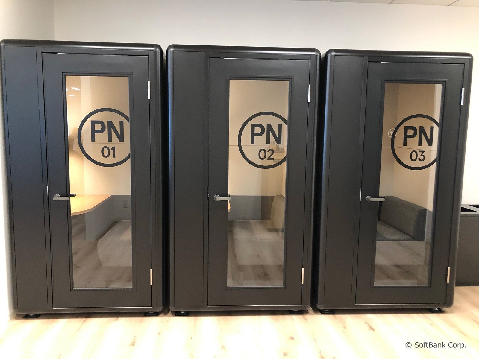 SoftBank Group: Three black phone booths labelled PN 01 to 03