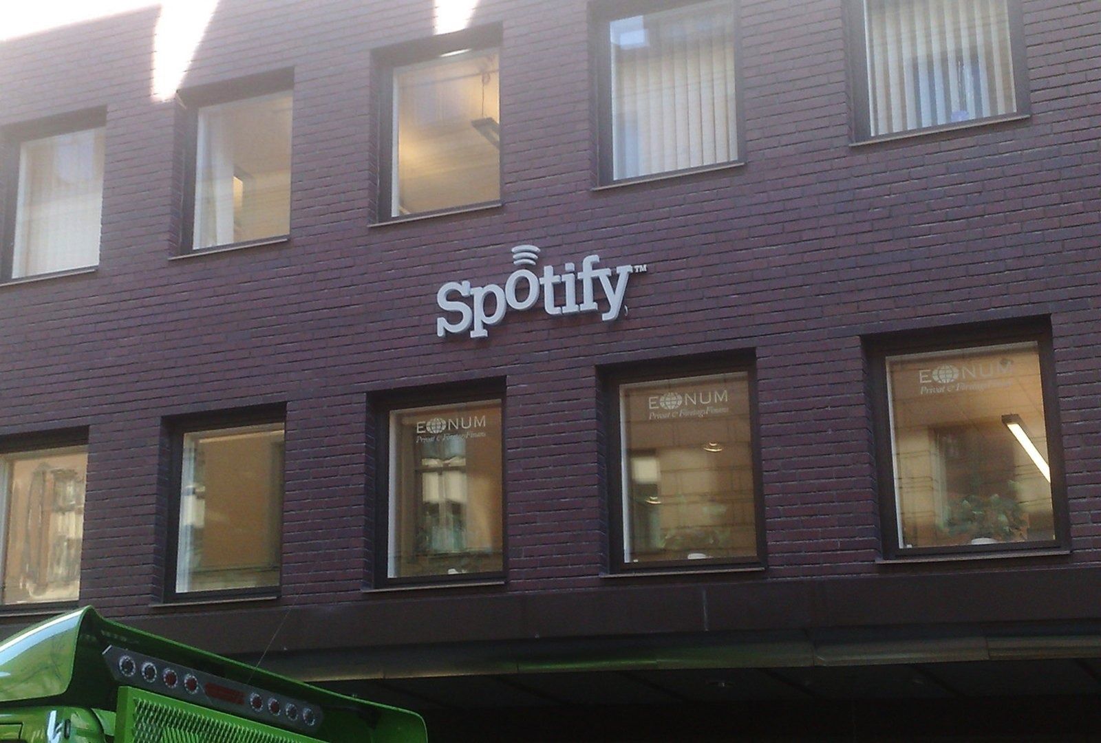 A brick building with a Spotify sign, 2007