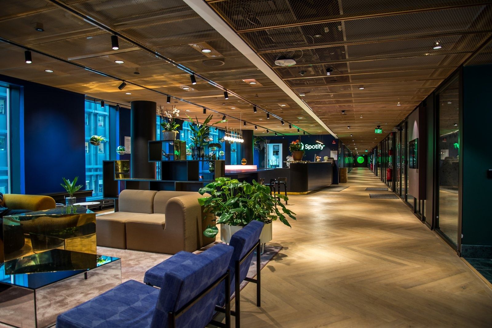 Spotify: A lounge corridor with blue sofas