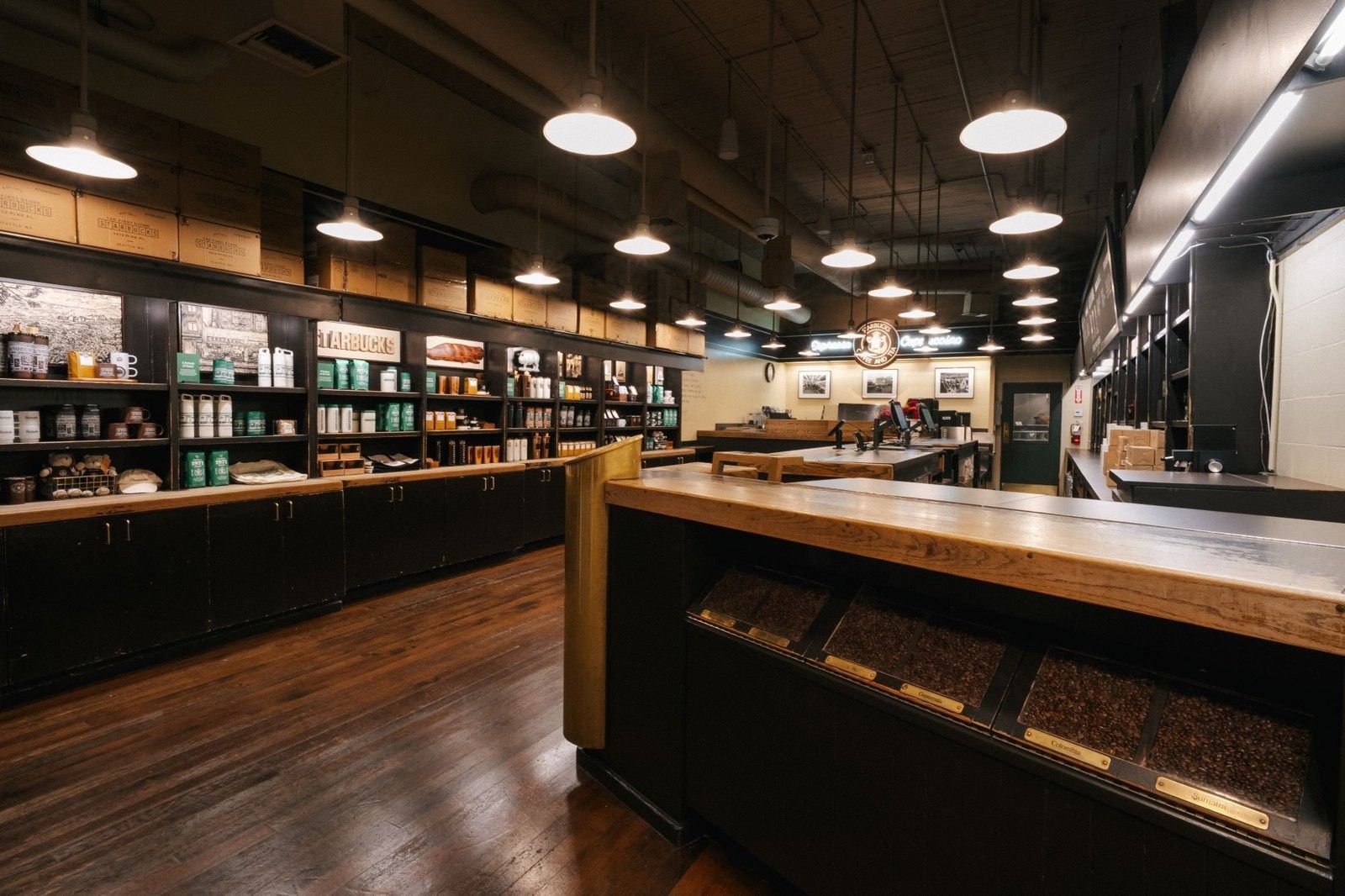 Starbucks: A long coffee bar under pendant lights