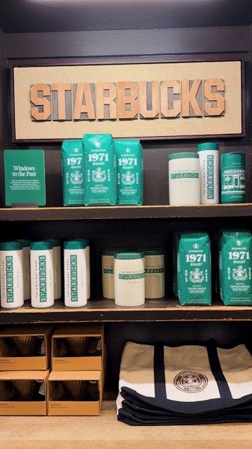 Starbucks: A wooden Starbucks sign over shelves