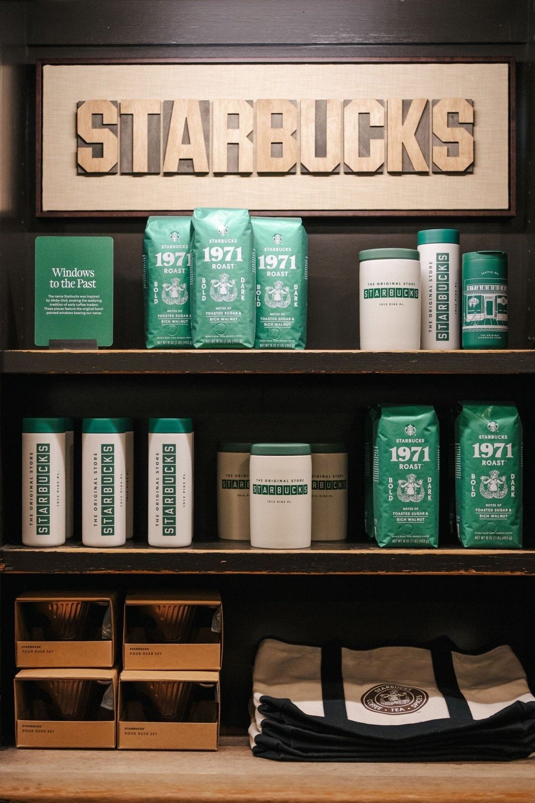 Starbucks: Shelves with Starbucks bags and tumblers