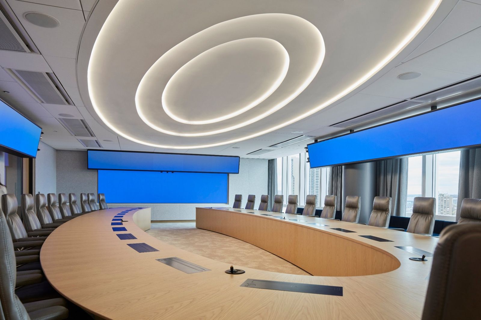 State Street: Boardroom with an oval table under circular ceiling lights