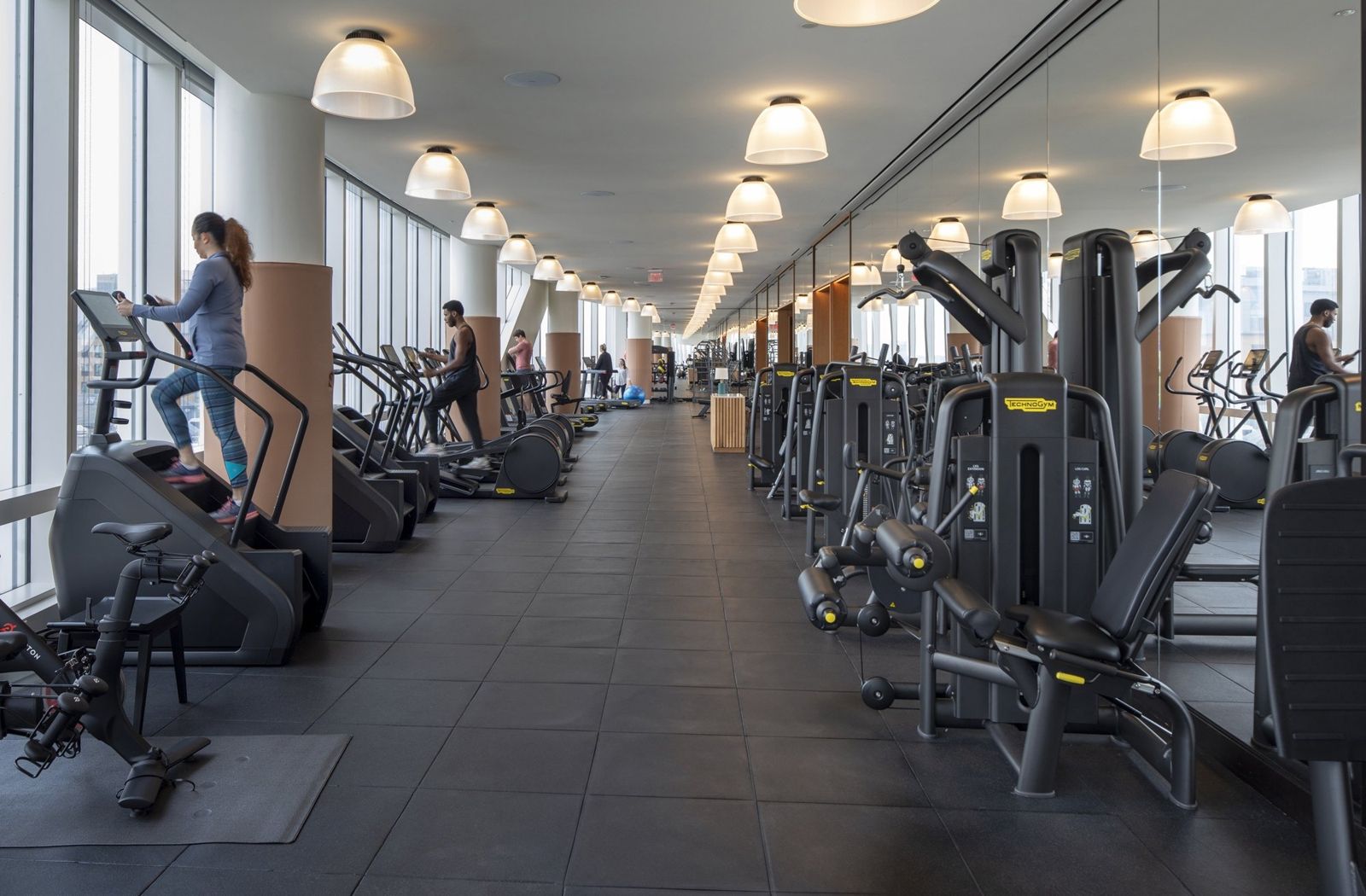 State Street: Fitness center with treadmills and machines along a window wall
