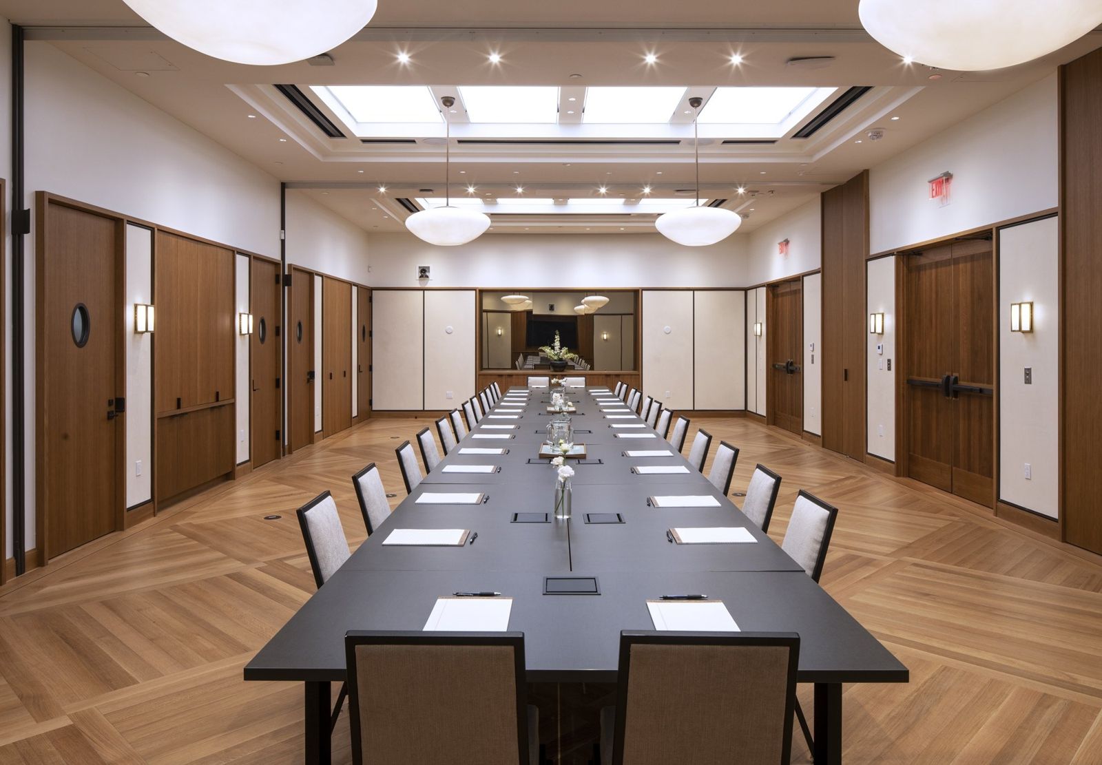 State Street: Long conference table in a wood-paneled room