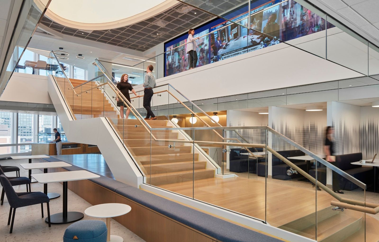 State Street: Stair with glass rails below a row of screens
