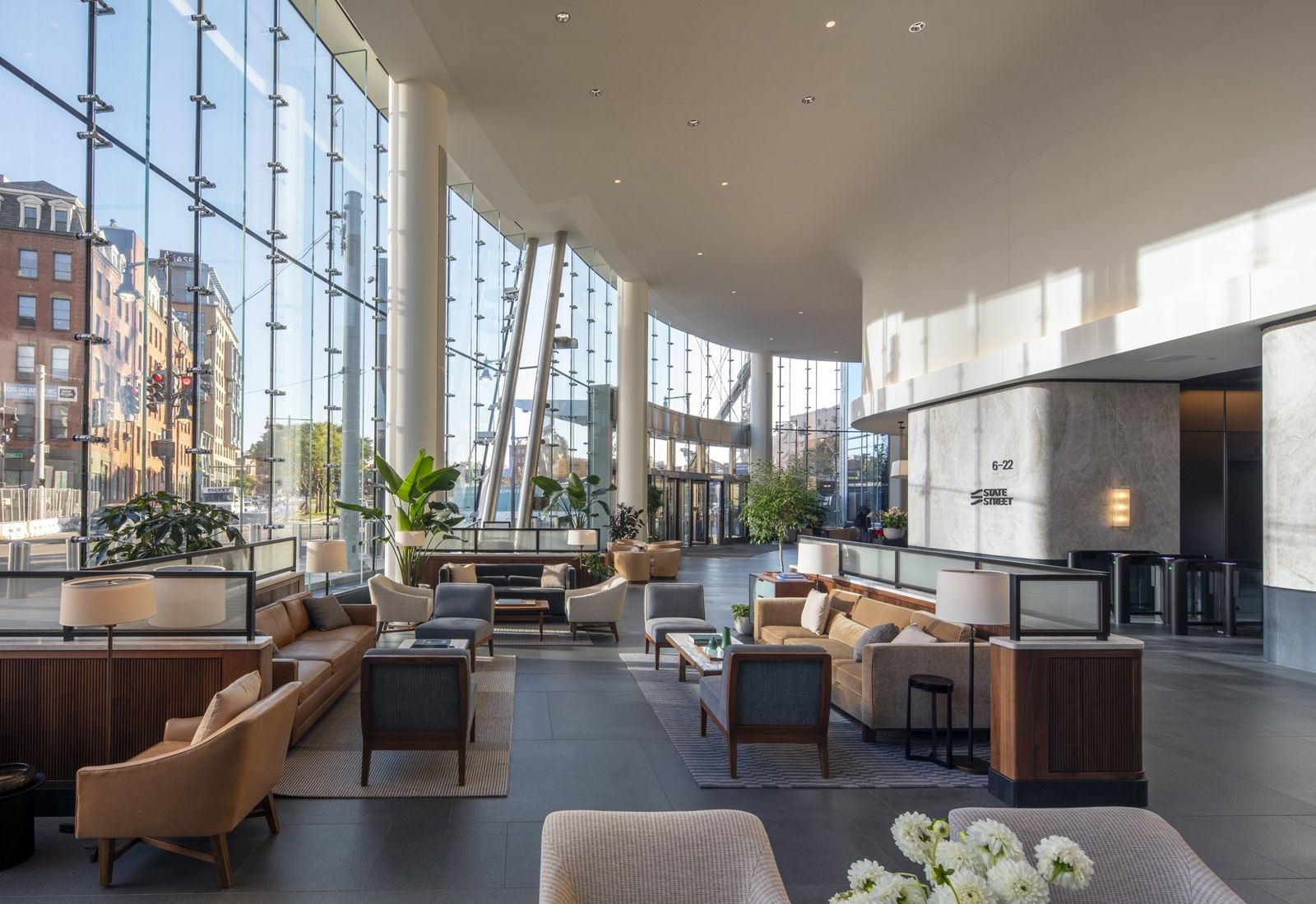 State Street: Tall lobby with wood walls and a reception desk