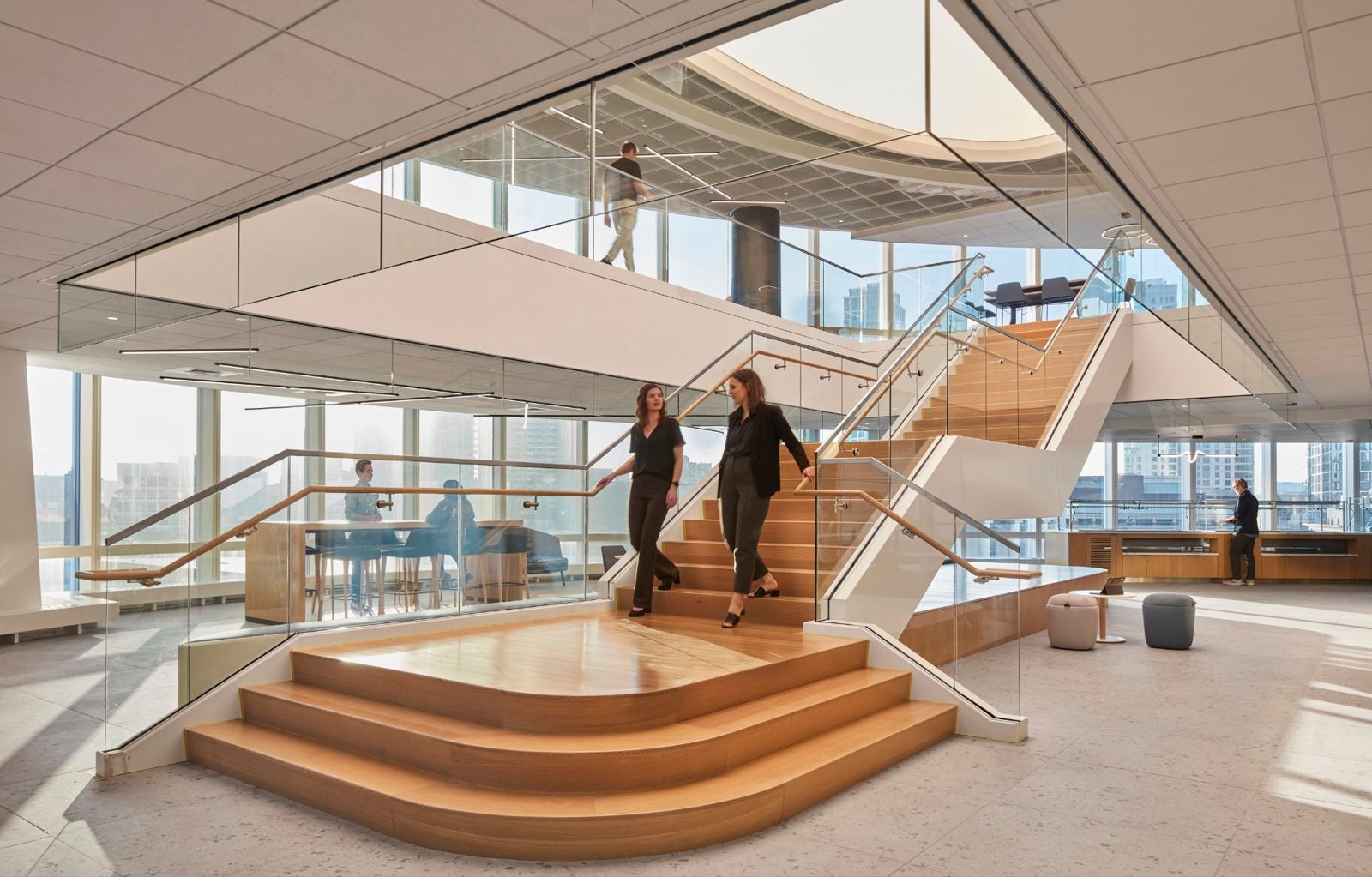 State Street: Wide wooden stair with seating steps beside tall windows