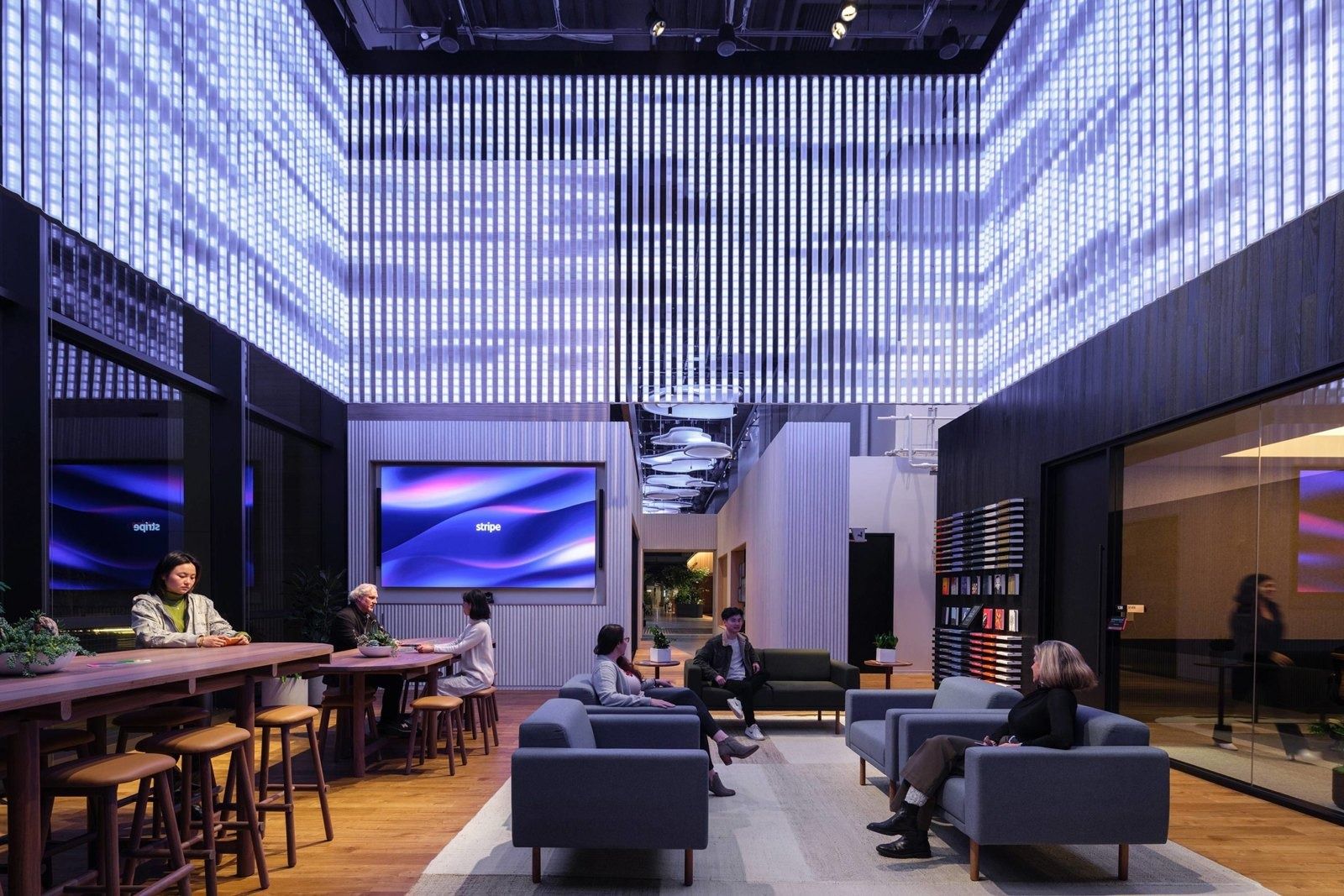 Stripe: A lounge under a glowing light installation