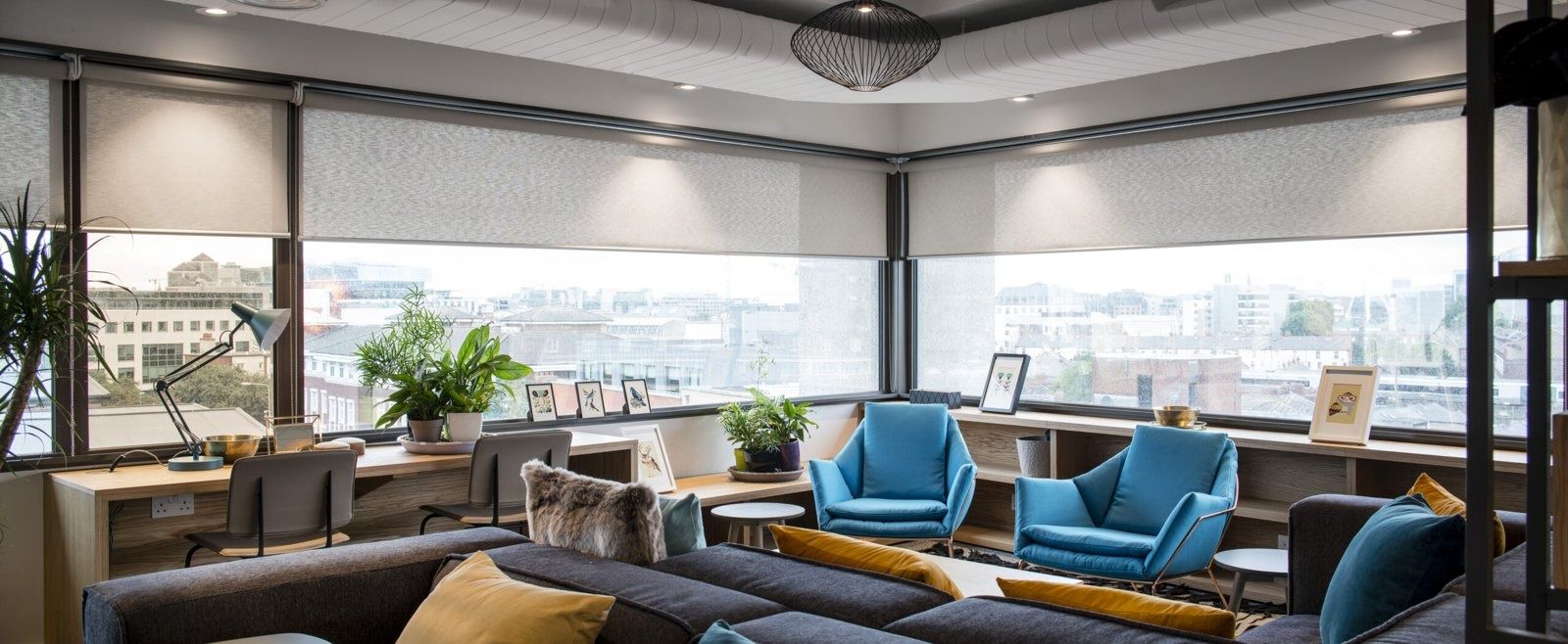 Stripe: A lounge with blue chairs and city views