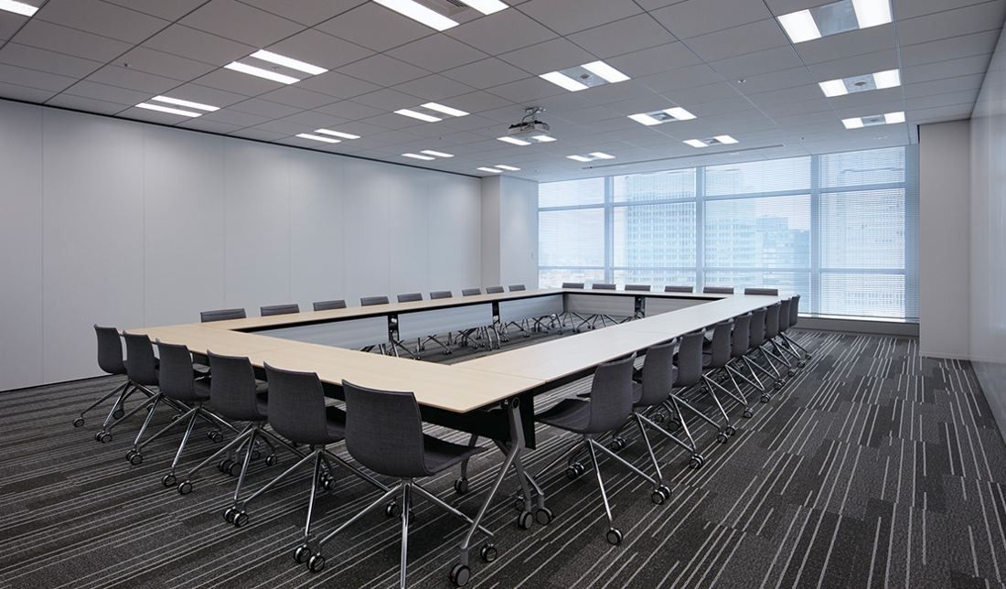 Sumitomo Corporation: Large meeting room with tables arranged in a hollow square