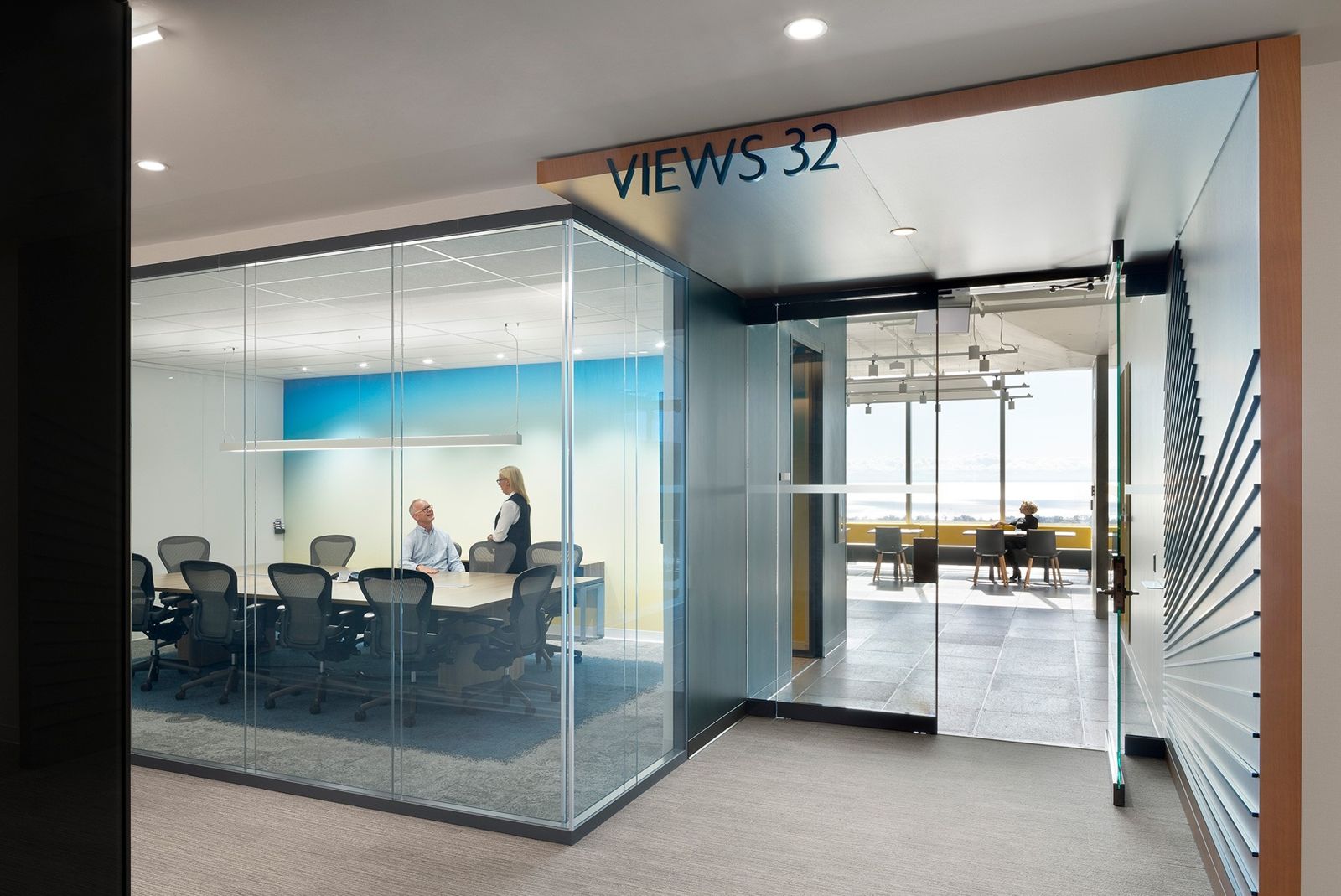 Sun Life: A glass meeting room with a lake view