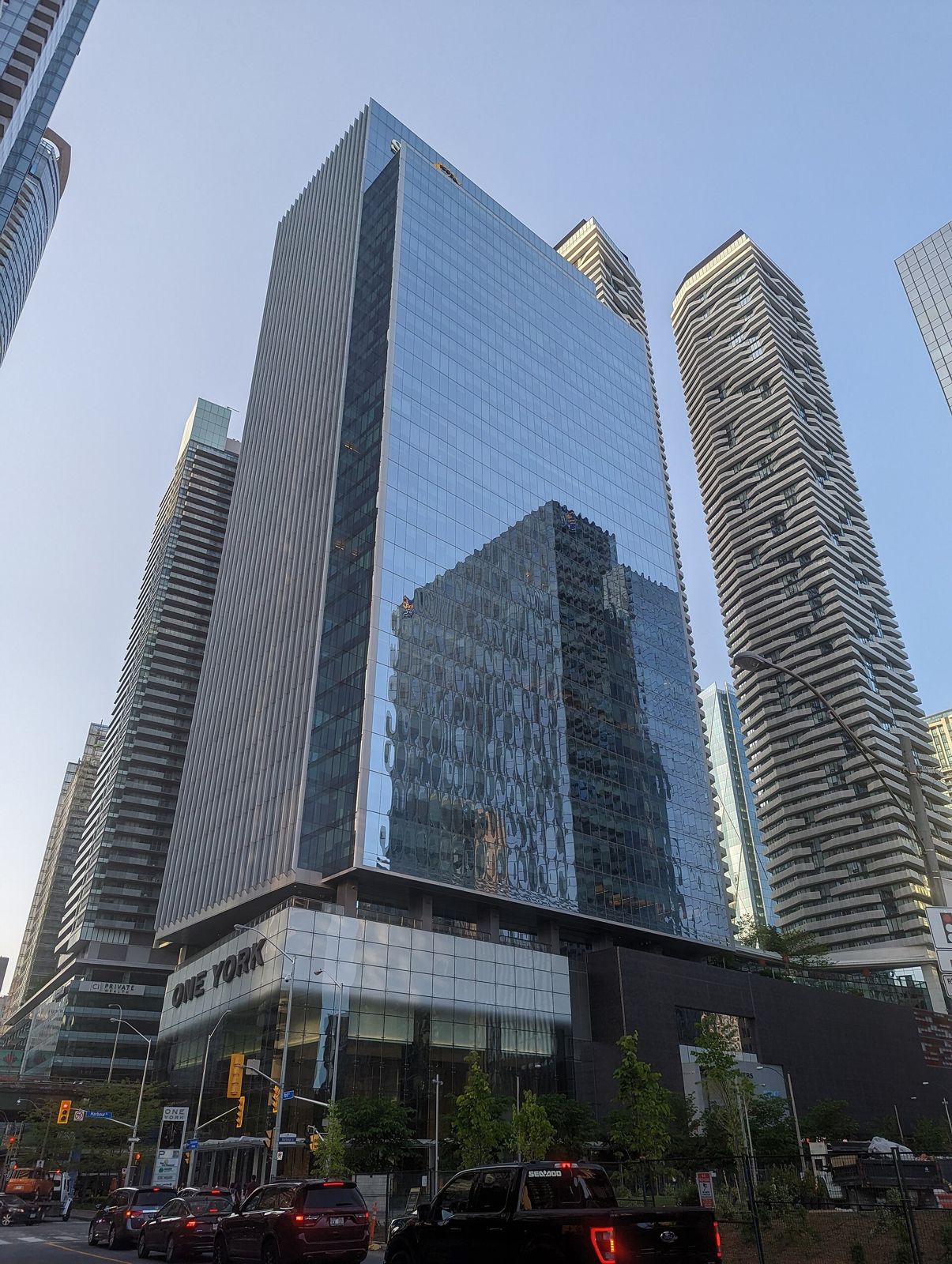 Sun Life: A glass tower above a low glass podium with the One York sign