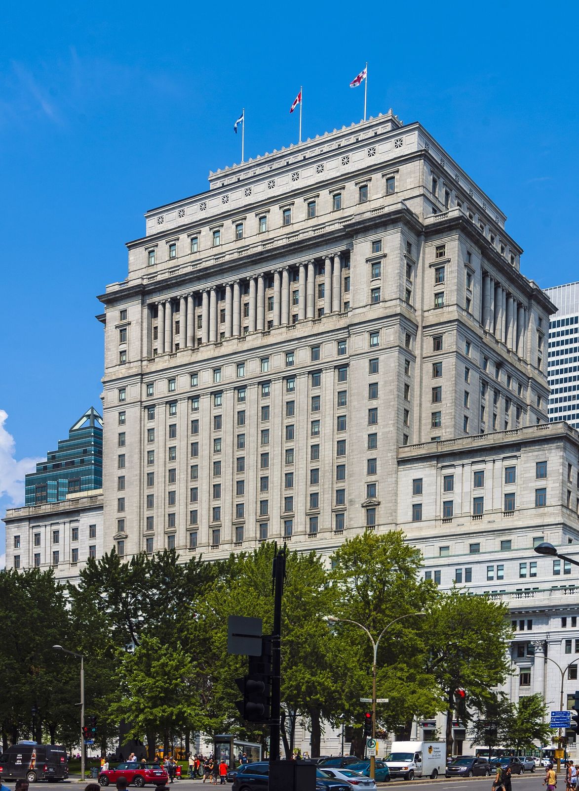 Sun Life: A grand stone building with flags on the roof