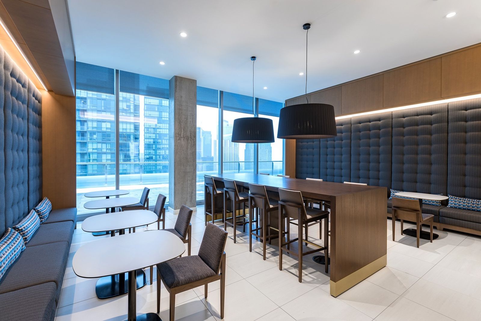 Sun Life: Booths and high tables by floor-to-ceiling windows