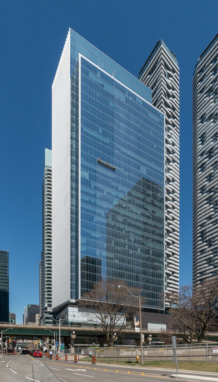 Sun Life: Slim glass tower with neighboring towers