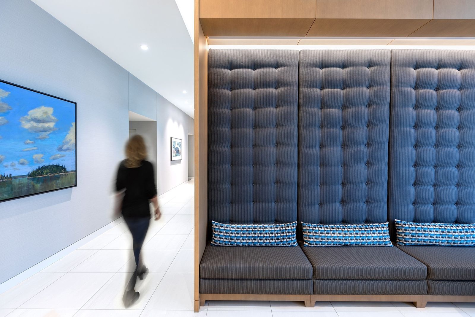 Sun Life: Tall upholstered booth seating along a corridor