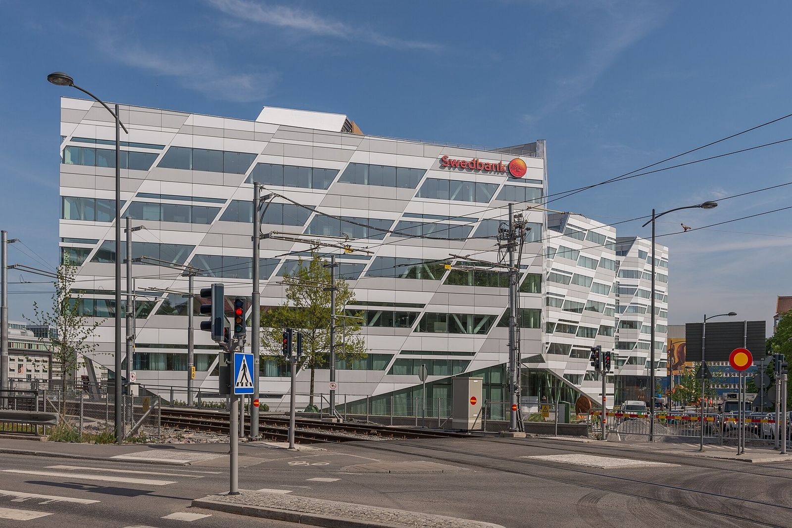 Swedbank: A white office building with the Swedbank sign at a crossing