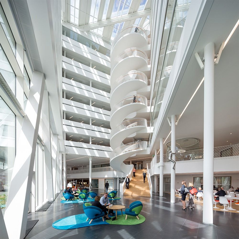 Swedbank: A white spiral stair rising through a glass atrium