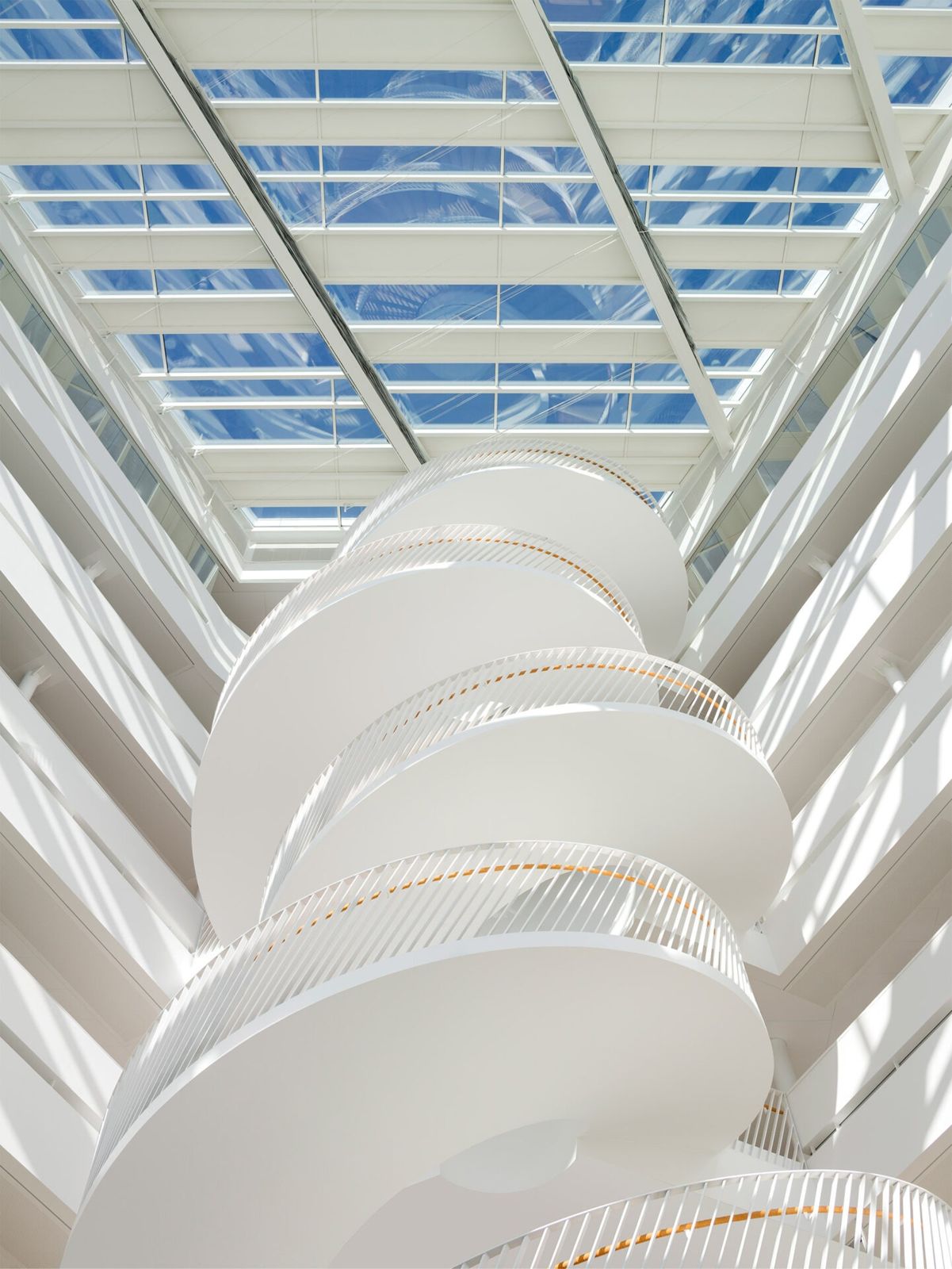 Swedbank: A white stair spiralling up toward a glass roof