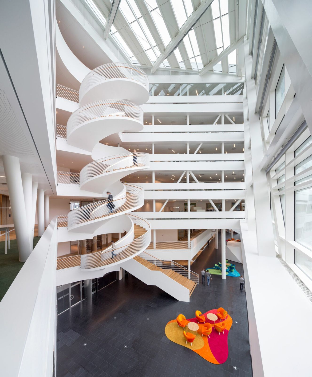 Swedbank: Several white spiral stairs stacked in a tall atrium