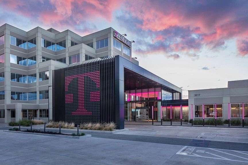 T-Mobile US: Entrance pavilion with a large T sign under a pink sky