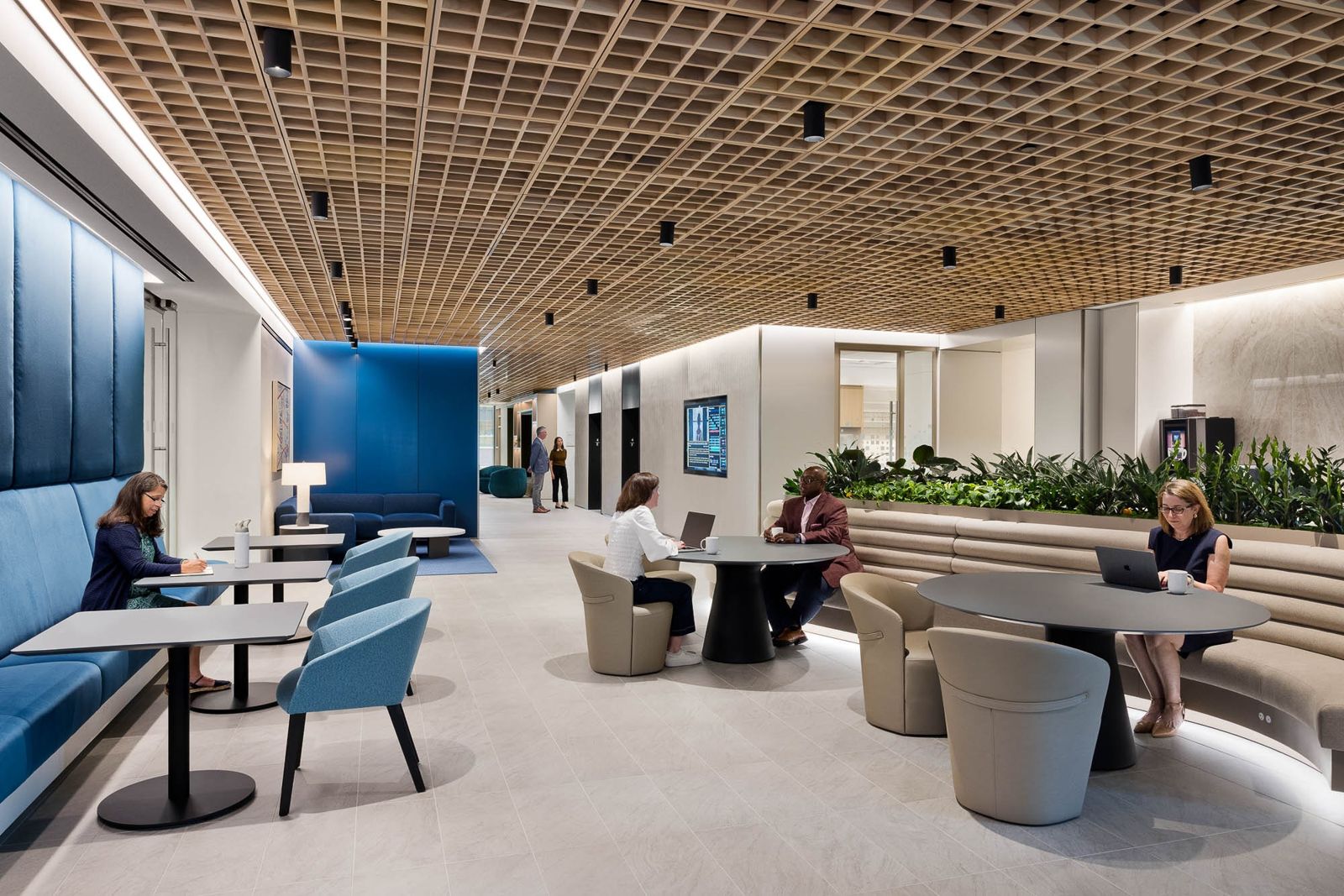 T. Rowe Price: A café-like area with booths, high tables and a slatted timber ceiling