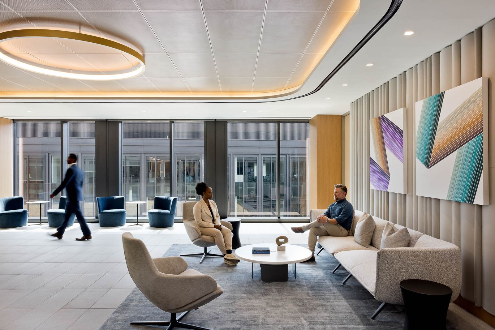 T. Rowe Price: A client lounge with low armchairs and colourful art