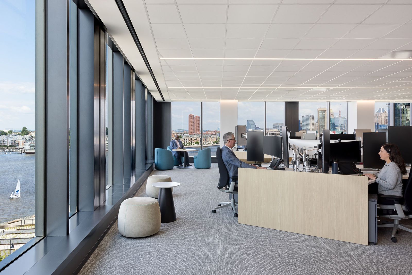 T. Rowe Price: Desks along a window looking over the Baltimore harbor