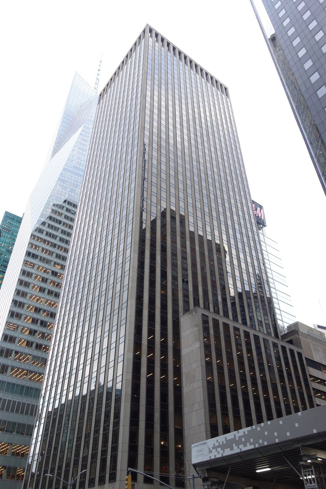 Take-Two Interactive: Dark glass-and-stone office tower seen from below at a street corner
