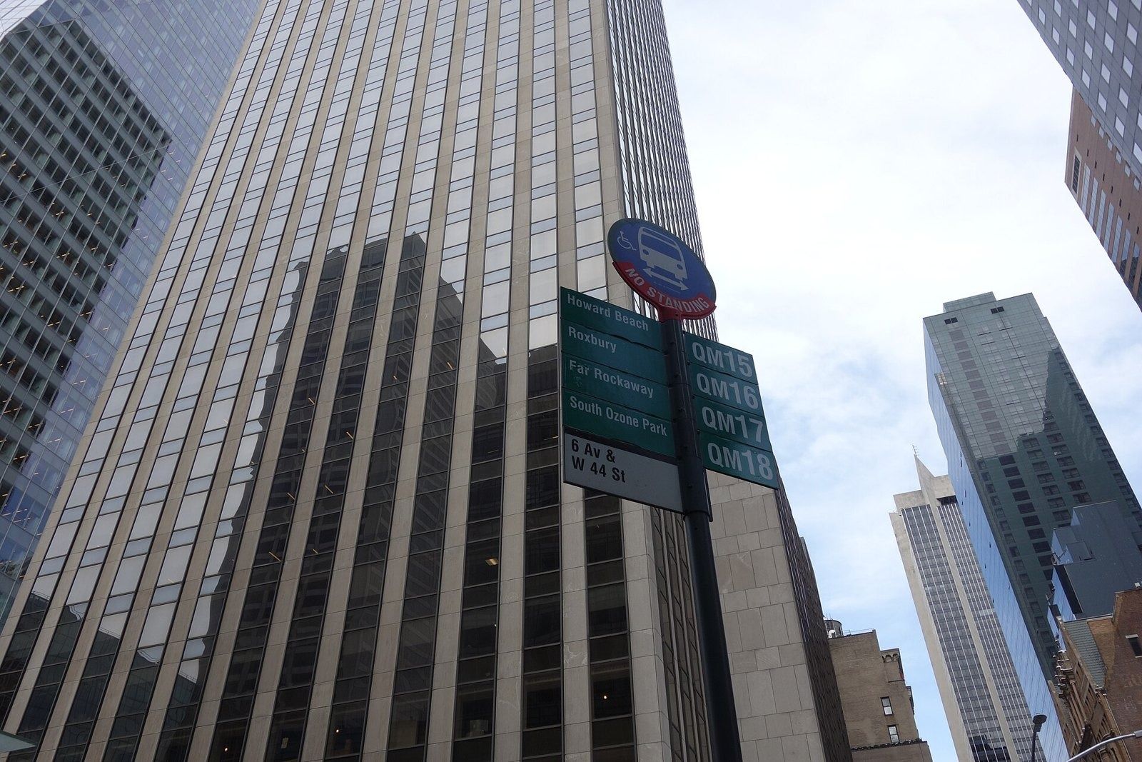 Take-Two Interactive: Office tower seen from below with a bus stop sign in the foreground