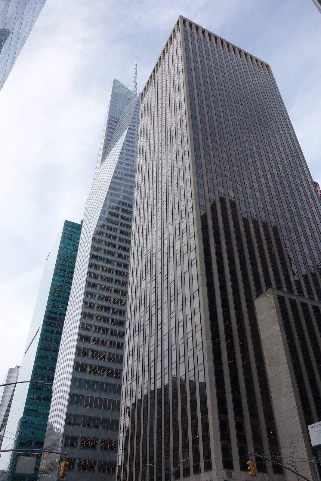 Take-Two Interactive: Tall dark office tower rising above a street corner against a pale sky
