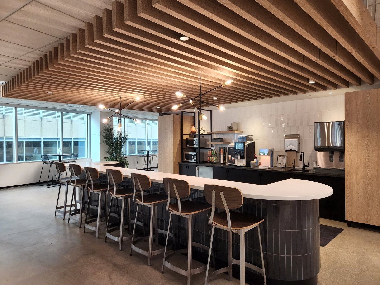 Target: Kitchenette with a timber slat ceiling and bar stools