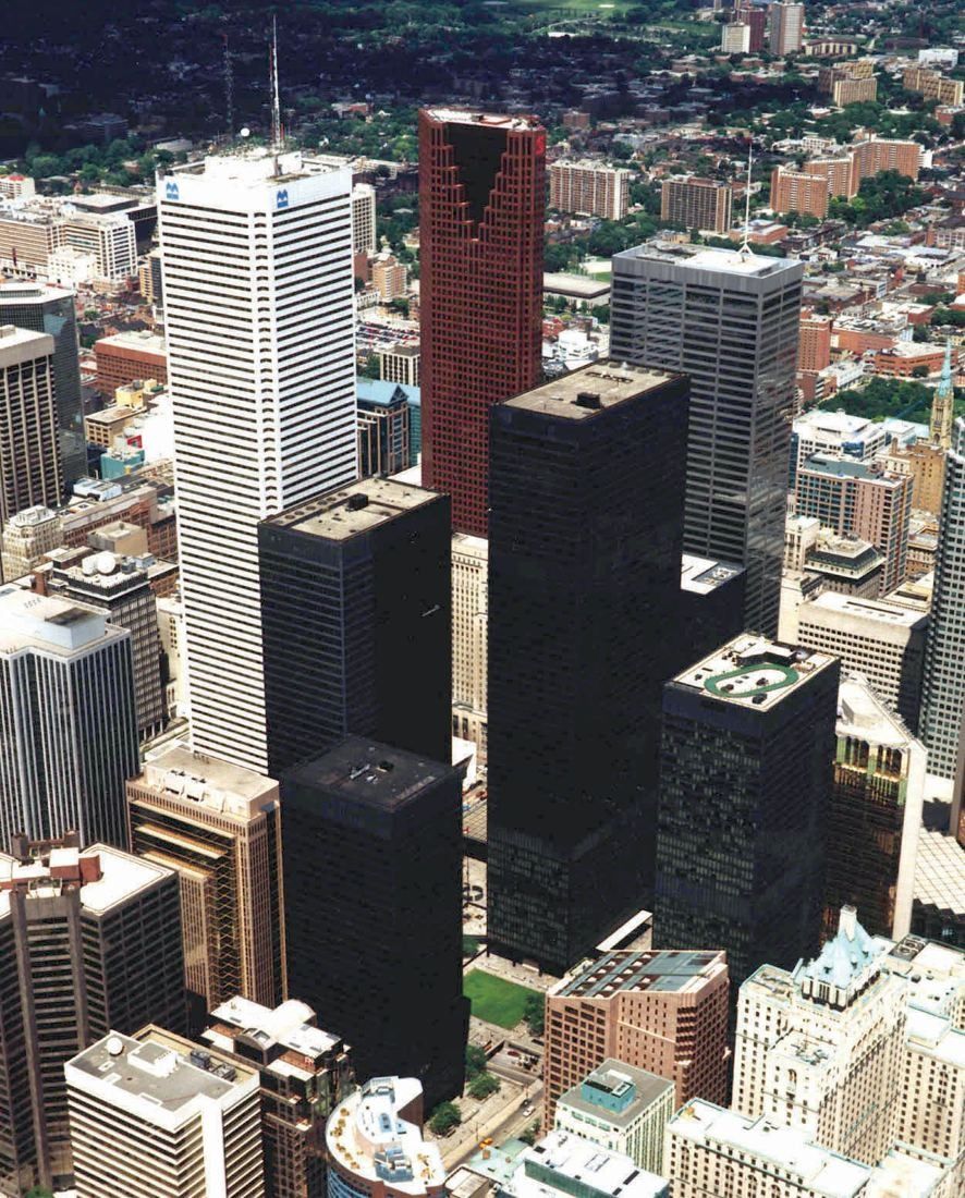 TD Bank Group (The Toronto-Dominion Bank): Aerial view of several black towers among downtown buildings