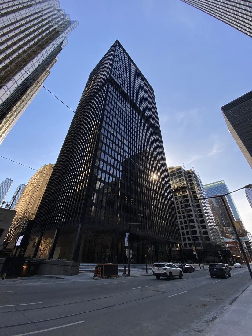 TD Bank Group (The Toronto-Dominion Bank): Black tower at a street corner seen from a low angle
